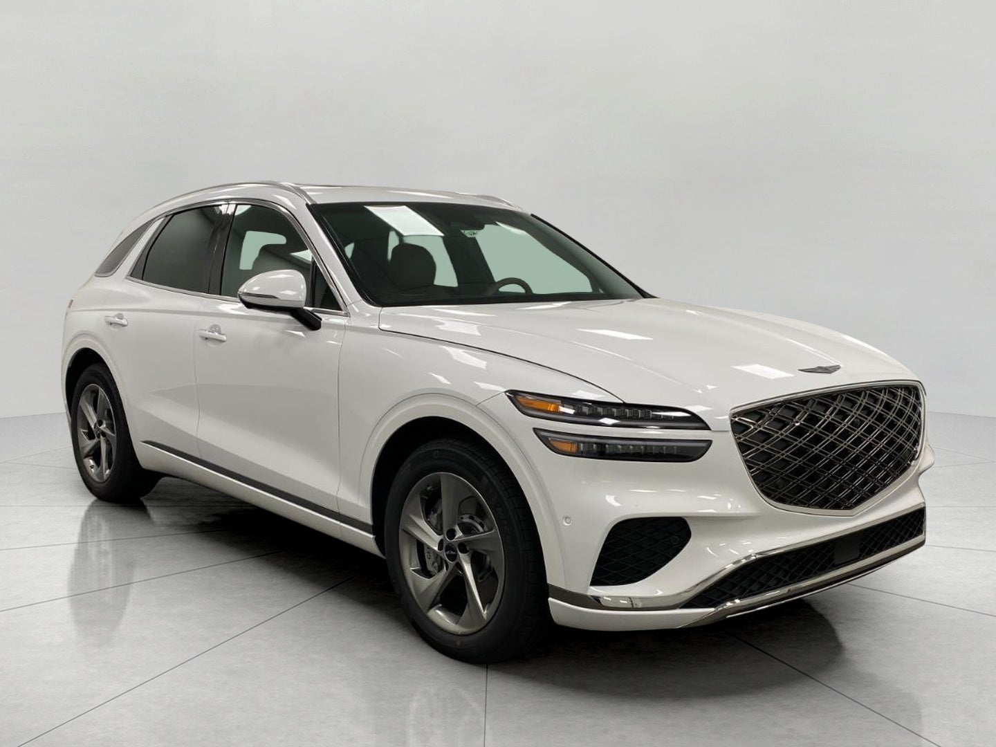 2026 Genesis GV70 2.5T ADVANCED in Uyuni White — front three-quarter view