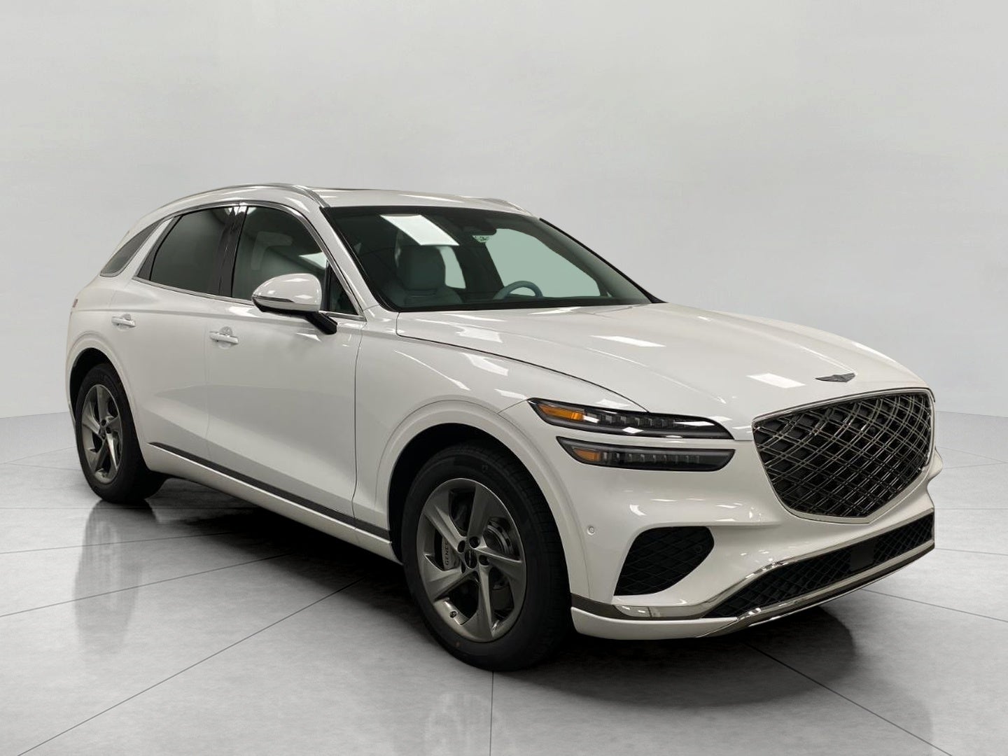 2026 Genesis GV70 2.5T ADVANCED in Uyuni White — front three-quarter view