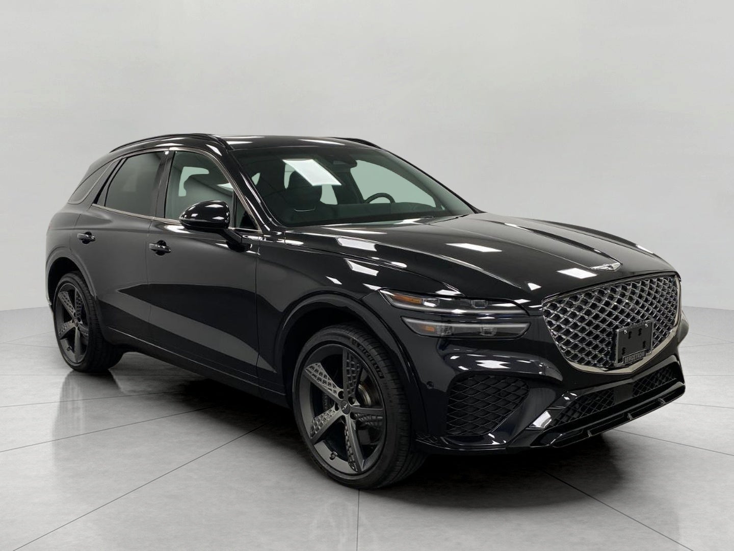 2024 Genesis GV70 3.5T Sport AWD in Vik Black — front three-quarter view
