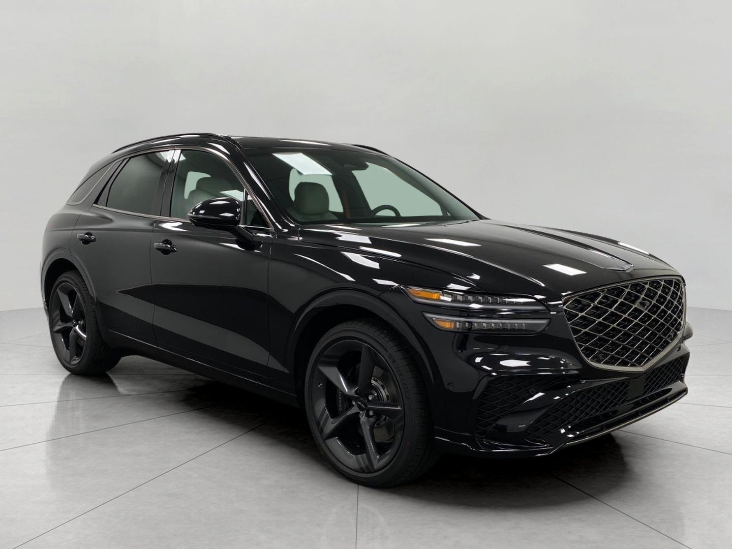 2026 Genesis GV70 3.5T SPORT PRESTIGE in Vik Black — front three-quarter view