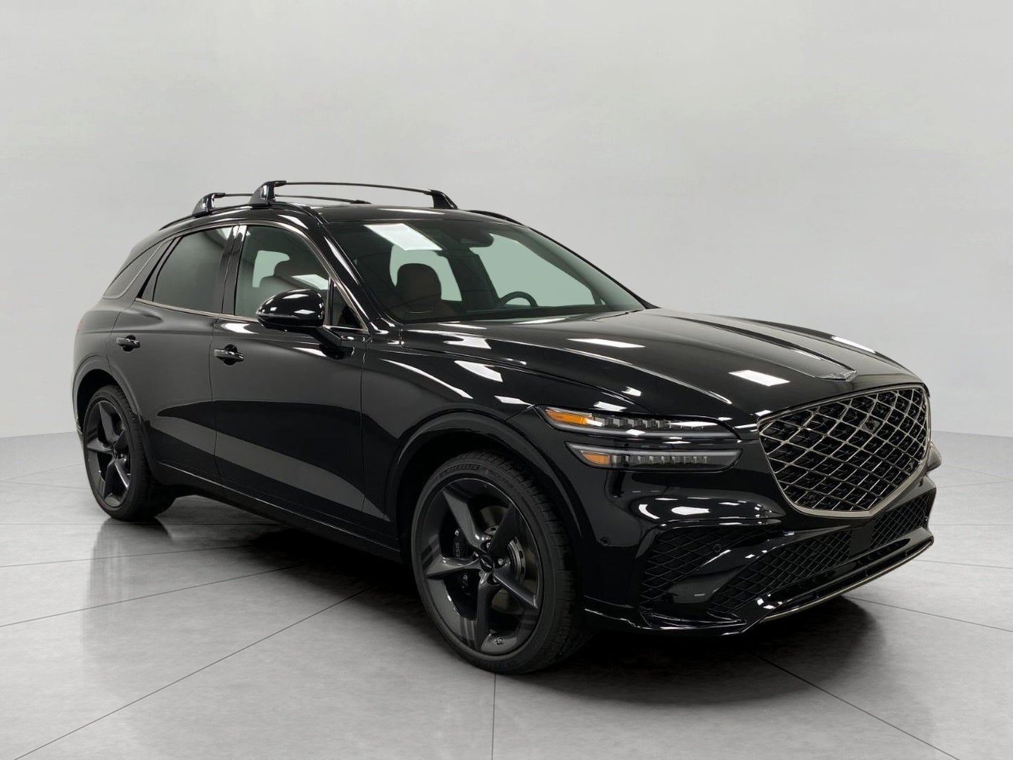 2026 Genesis GV70 3.5T SPORT PRESTIGE in Vik Black — front three-quarter view
