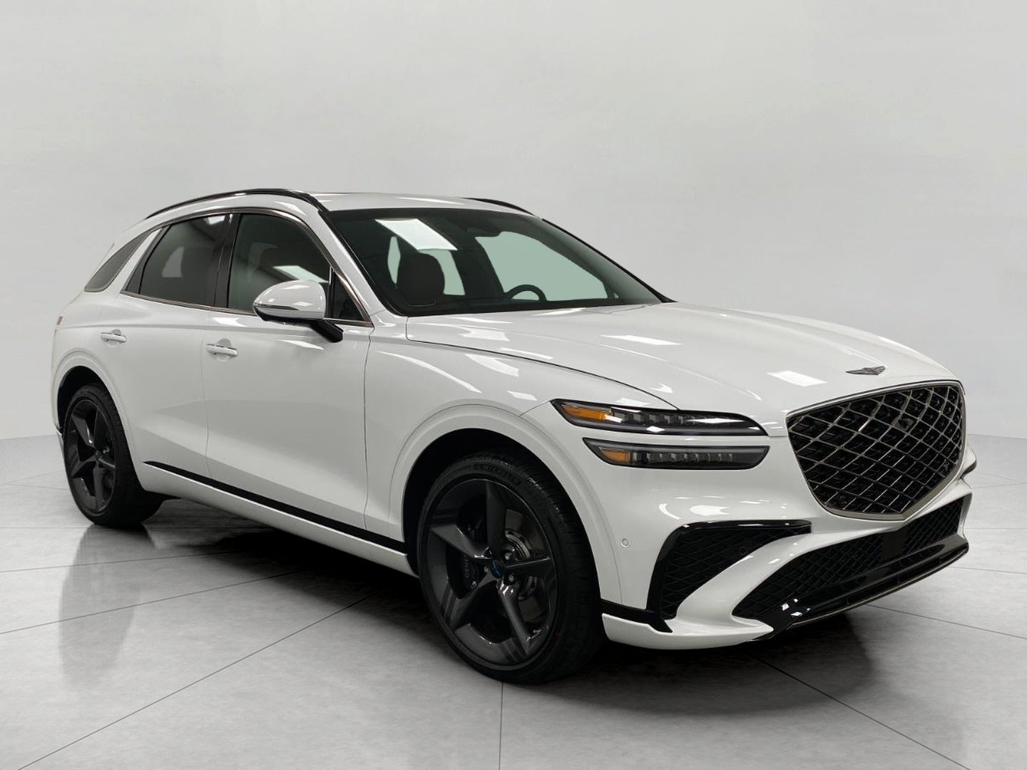 2026 Genesis GV70 3.5T SPORT PRESTIGE in Alta White — front three-quarter view