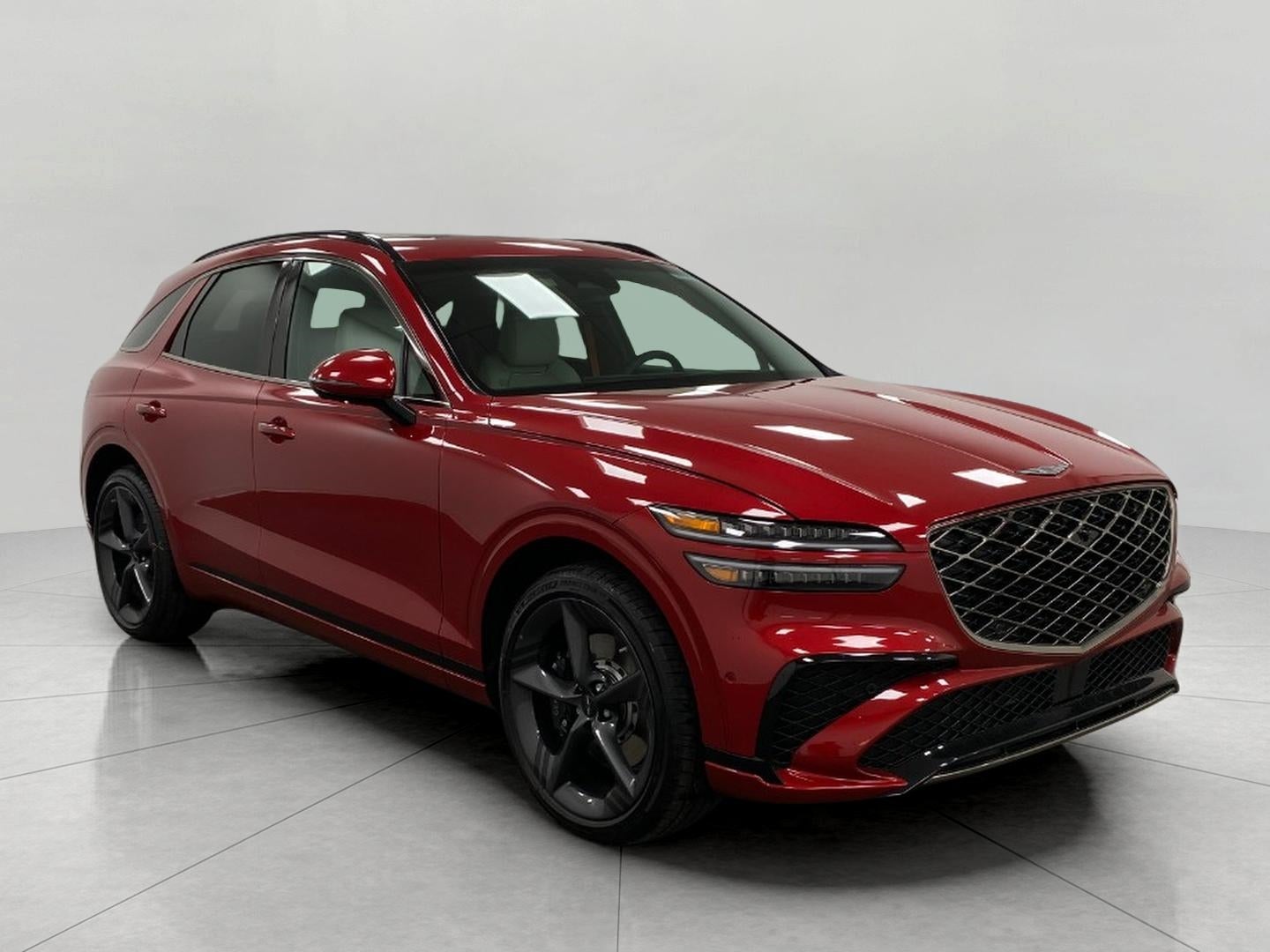 2026 Genesis GV70 3.5T SPORT PRESTIGE in Mauna Red — front three-quarter view