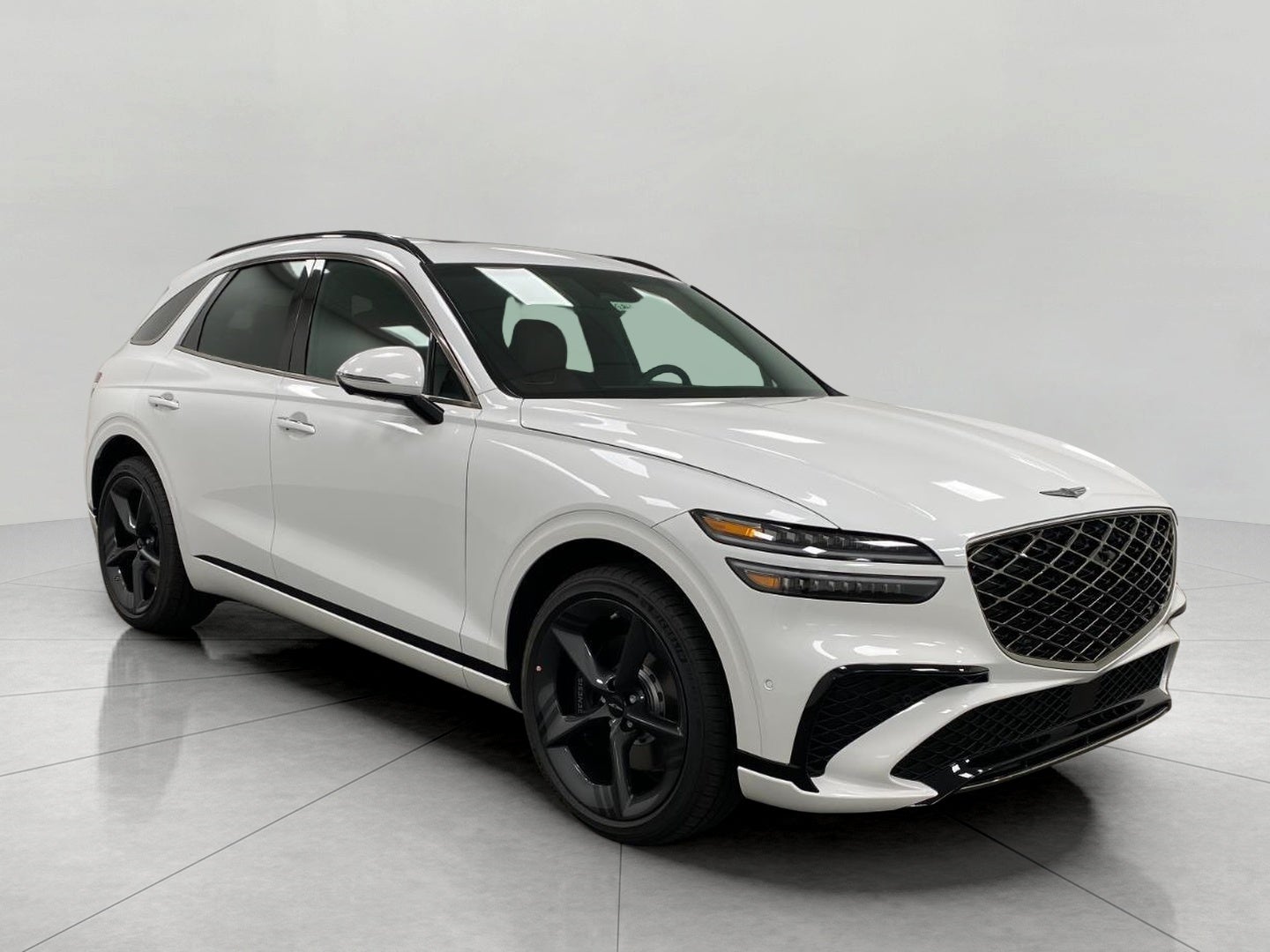 2026 Genesis GV70 3.5T SPORT PRESTIGE in Uyuni White — front three-quarter view