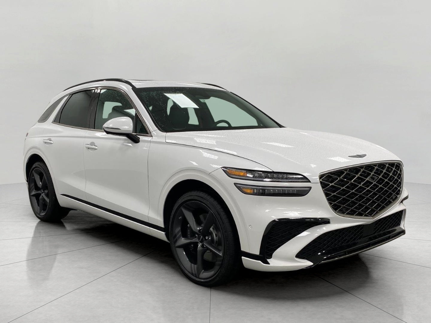 2026 Genesis GV70 2.5T SPORT PRESTIGE in Uyuni White — front three-quarter view
