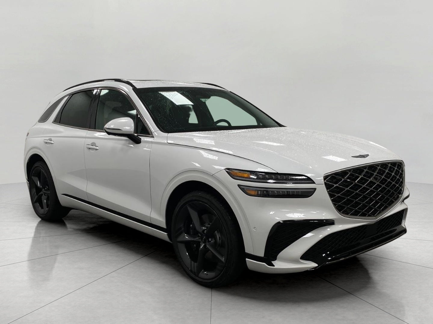 2026 Genesis GV70 2.5T SPORT PRESTIGE in Uyuni White — front three-quarter view
