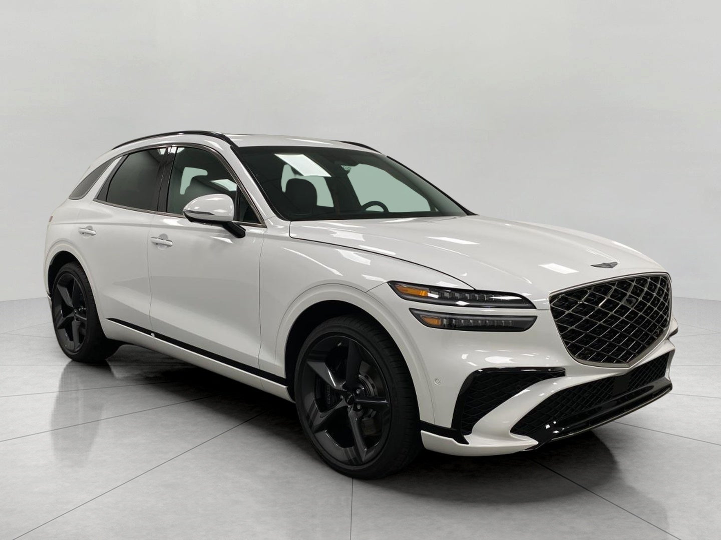 2026 Genesis GV70 2.5T SPORT PRESTIGE in Uyuni White — front three-quarter view