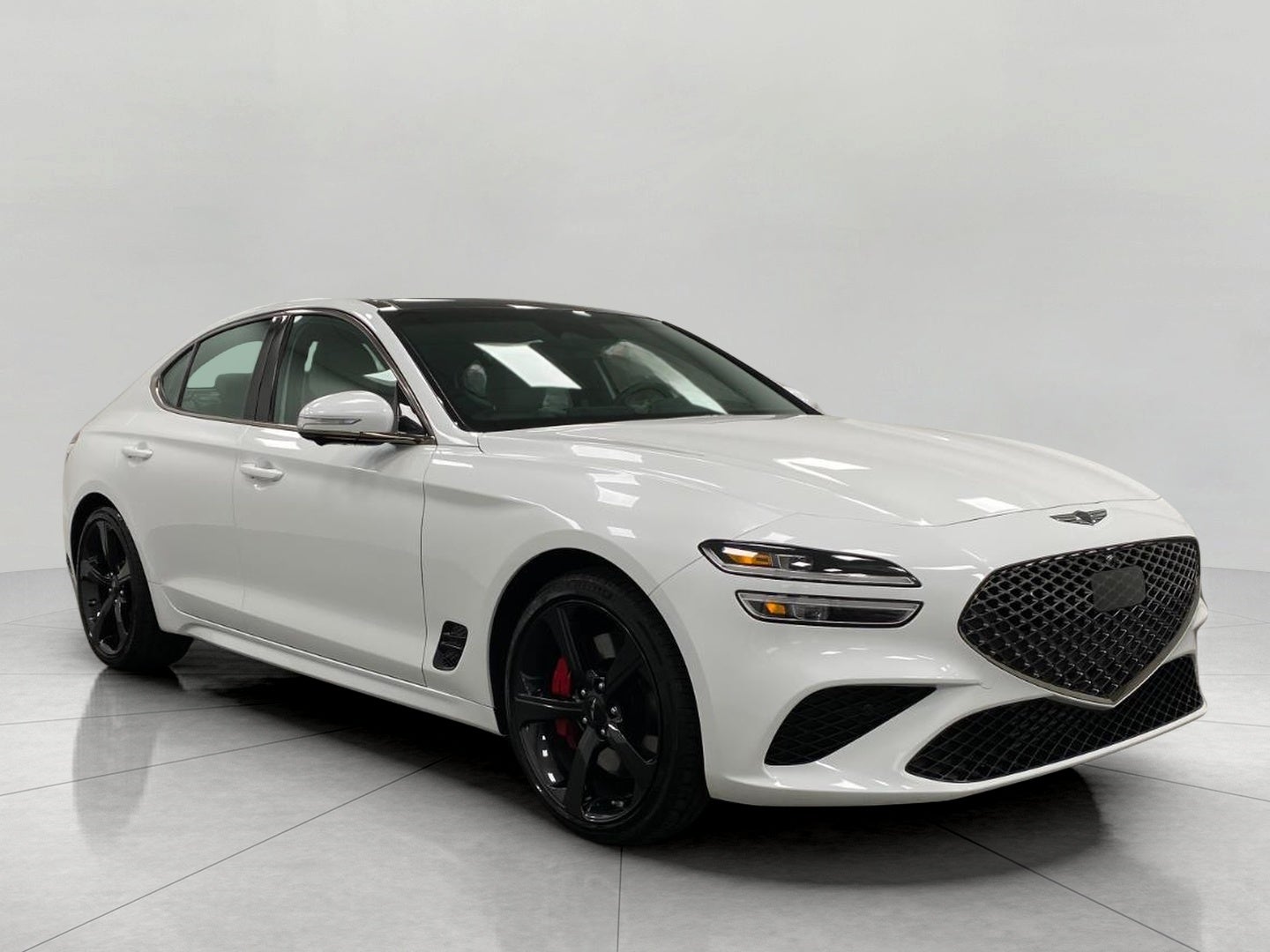 2026 Genesis G70 3.3T Sport Prestige AWD in Uyuni White — front three-quarter view