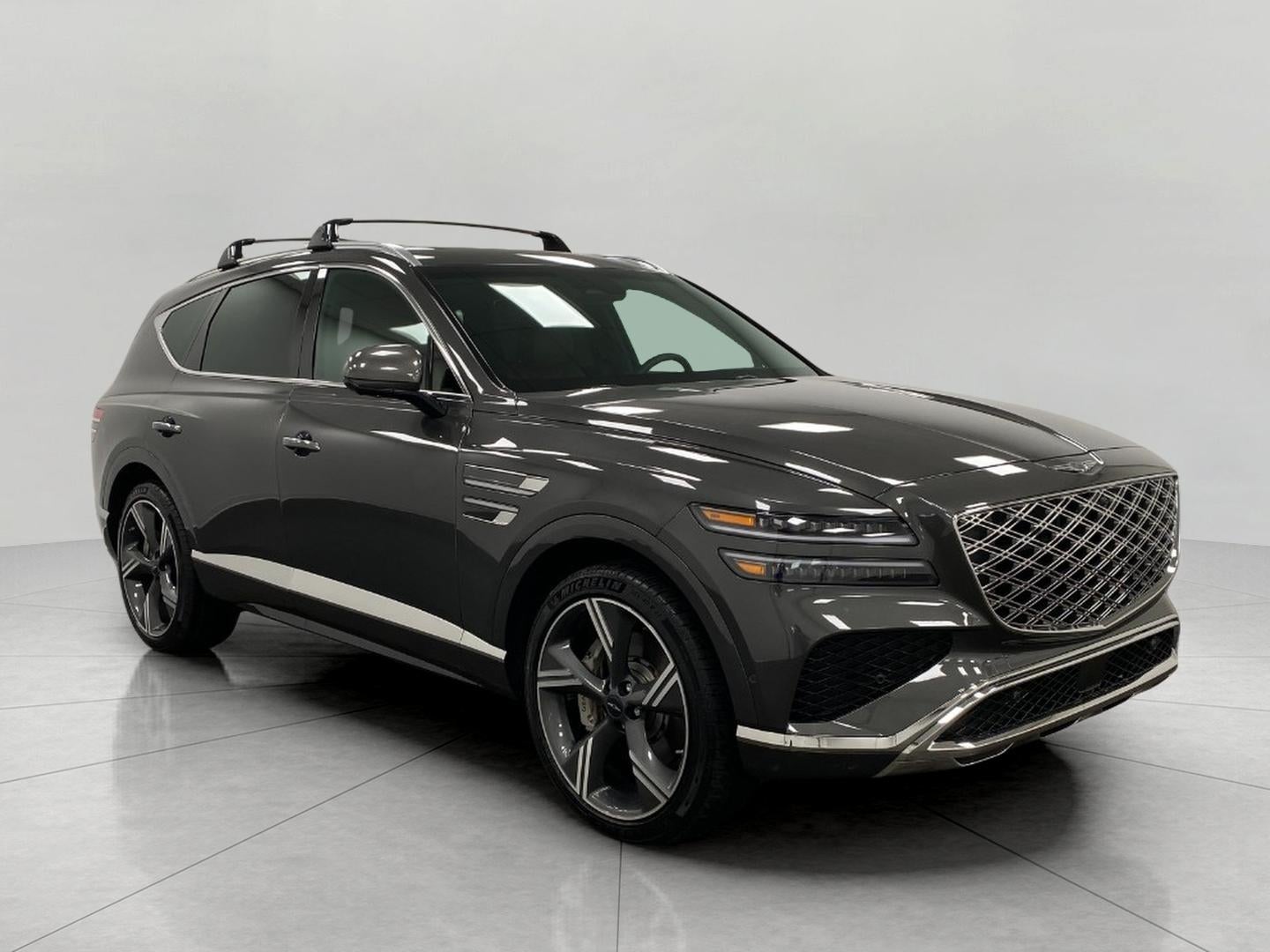 2026 Genesis GV80 3.5T Prestige AWD in Makalu Gray — front three-quarter view