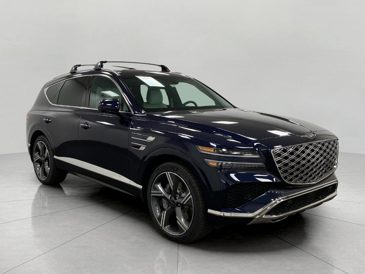 2026 Genesis GV80 3.5T PRESTIGE in Capri Blue — front three-quarter view