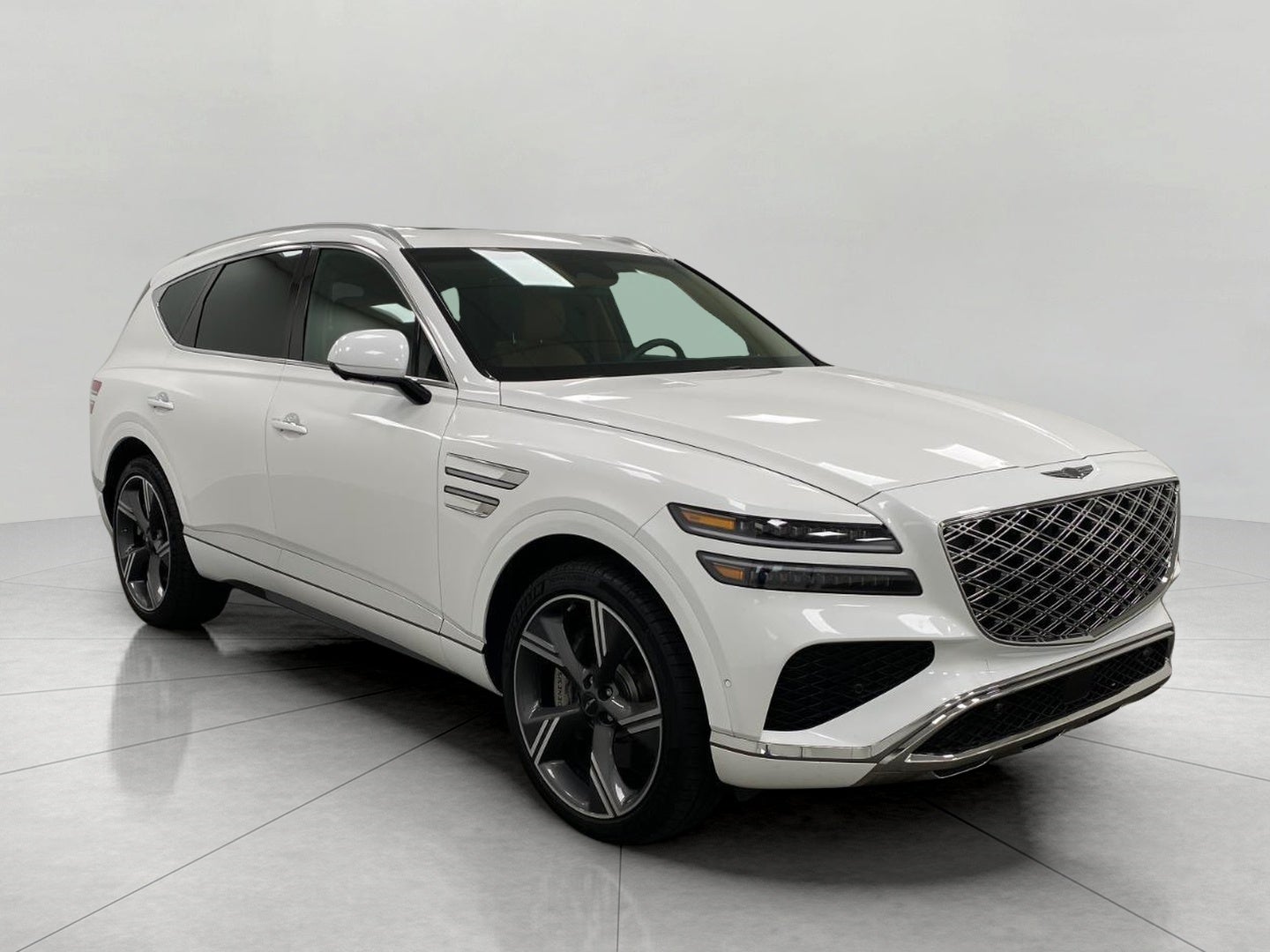 2026 Genesis GV80 3.5T Prestige AWD in Uyuni White — front three-quarter view
